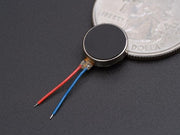 Mini vibration motor 2.0mm front view with size comparison to a coin