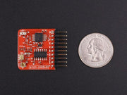 Tessel Ambient Module front view with size comparison to a coin