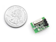 315MHz ASK&OOK Transmitter Module front view with size comparison to a coin