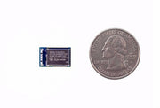 Bluetooth Low Energy Module front view with size comparison to a coin